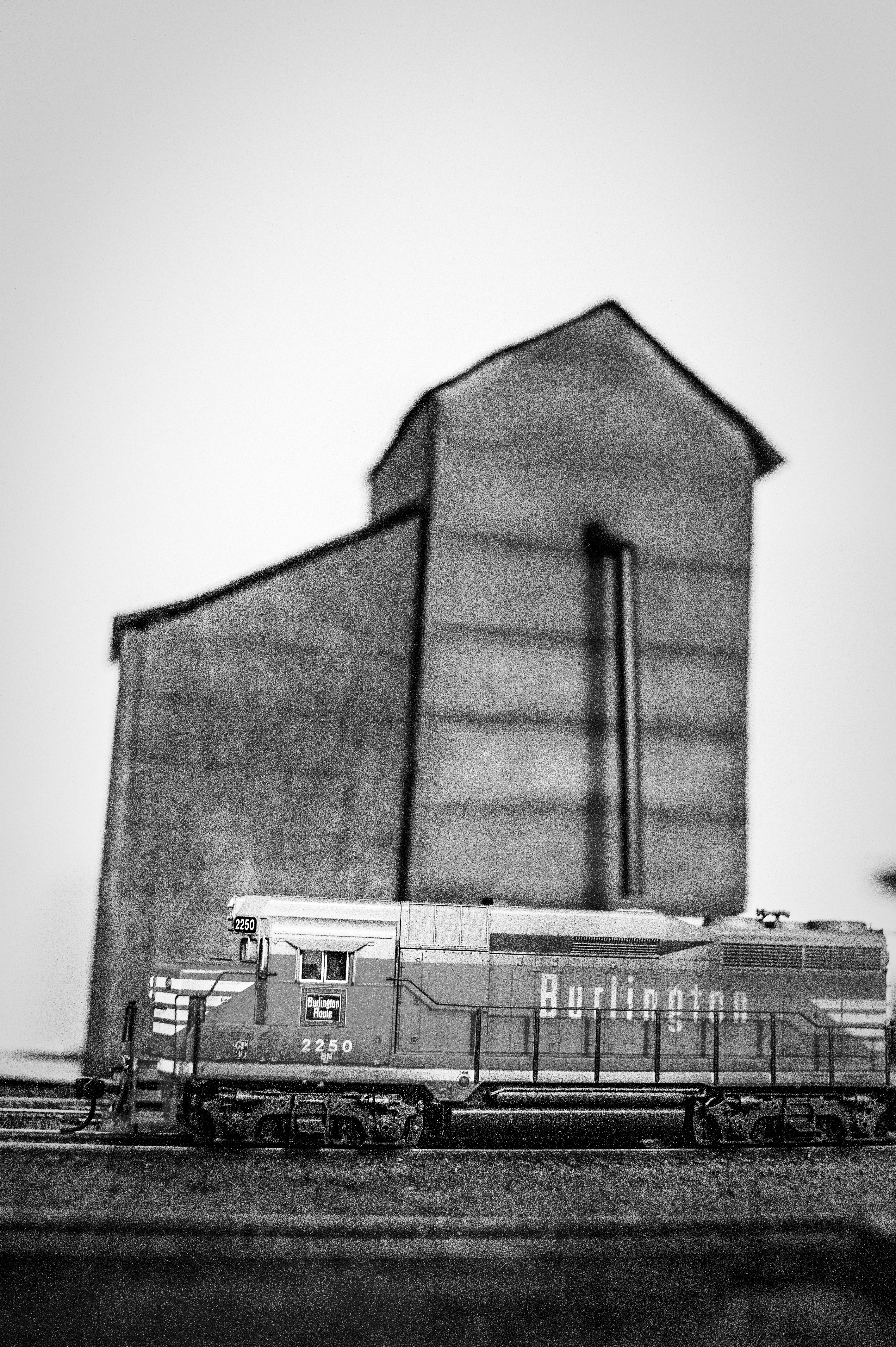 Grain elevator in Hardy with the local passing in front